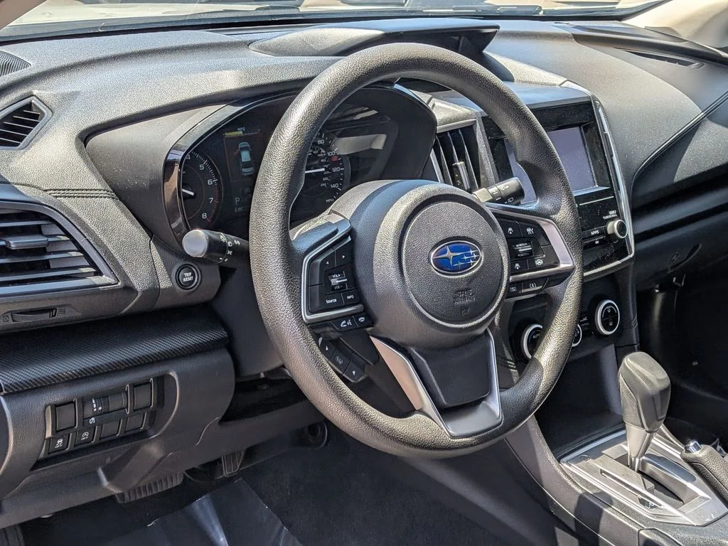 A used white Subaru Crosstrek on the pre-owned lot at Dalton Subaru National City